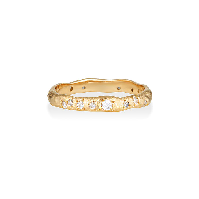 This is a picture of a gold ring with scattered topaz stones. They are varying sizes and set with irregular pattern. It is a reminder of the night sky and how beautifully loved you are.